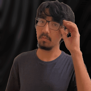 A man in glasses touches his temple with a surprised, doubtful look.